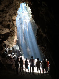 Group of people standing on rock formation