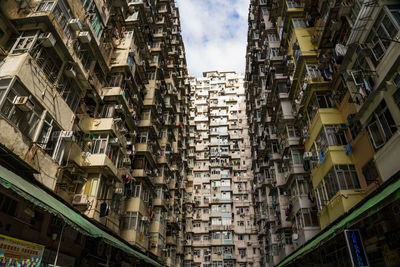 Low angle view of buildings in city against sky