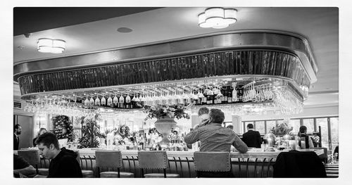 Rear view of people sitting in restaurant