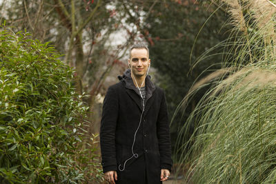 Portrait of smiling man standing outdoors