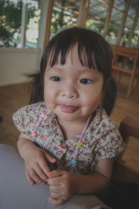 Portrait of cute girl at home