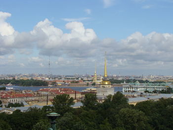 View of buildings against cloudy sky