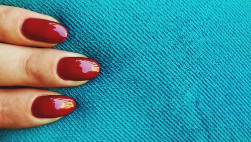 Low section of woman wearing multi colored pencils