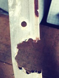 Close-up of cigarette on wood