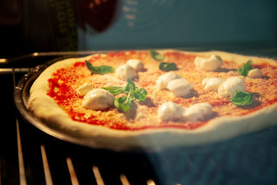 Close-up of pizza served on table