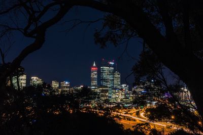 Illuminated buildings in city at night