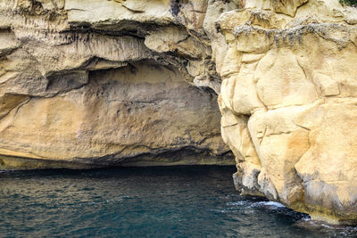 Close-up of rock formation in sea