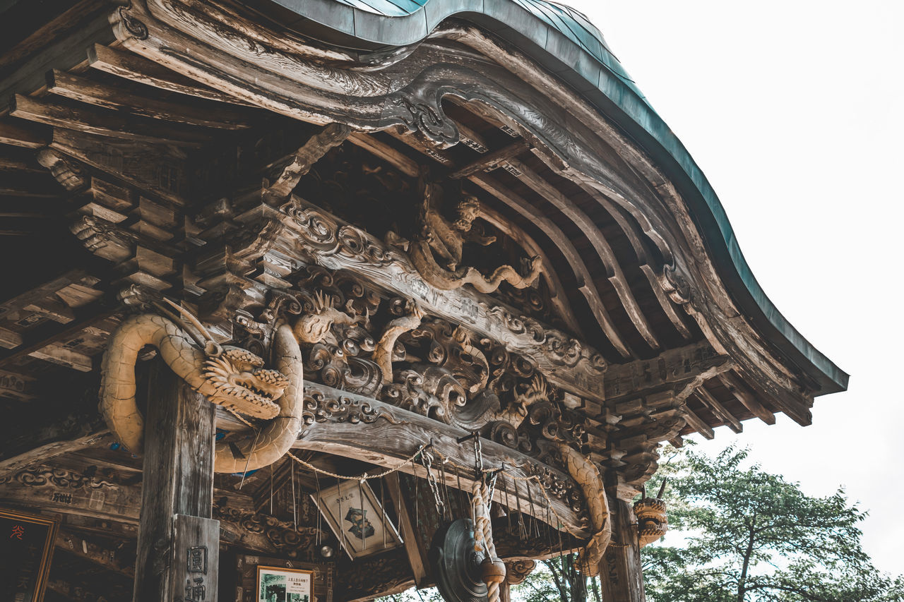 architecture, built structure, low angle view, travel destinations, history, religion, the past, building exterior, belief, place of worship, no people, building, spirituality, sky, temple - building, temple, travel, day, craft, landmark, tourism, tree, nature, sculpture, outdoors, ancient, city, ornate, clear sky