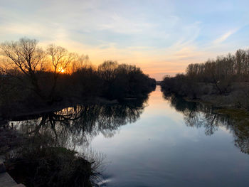 Scenic view of lake against sky during sunset