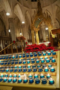 Illuminated candles in temple