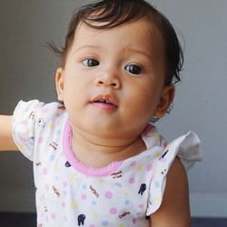 Portrait of cute baby girl at home