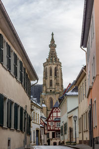 Cobbled alley with half-timbered houses and castle church in meisenheim, germany in winter