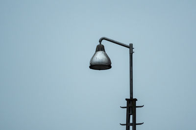 Low angle view of street light against clear sky