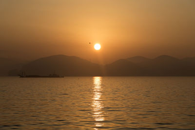 Scenic view of lake against sky during sunset