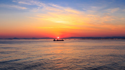 Scenic view of sea against sky during sunset