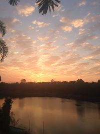 Scenic view of lake against sky during sunset