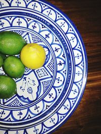 High angle view of fruits in plate on table