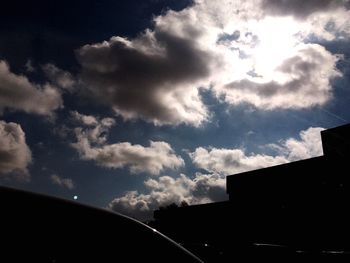 Low angle view of building against cloudy sky