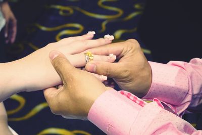 Close-up of hand holding flower