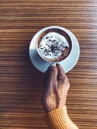 High angle view of coffee cup on table