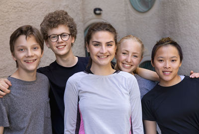 Teenagers wearing sportswear looking at camera