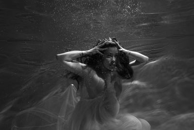 Woman swimming in pool