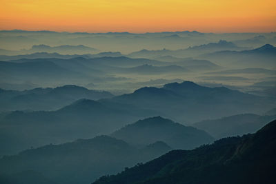 Scenic view of mountains against sky during sunset