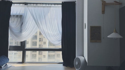 White curtain on window at home