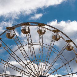 Low angle view of ferris wheel against sky