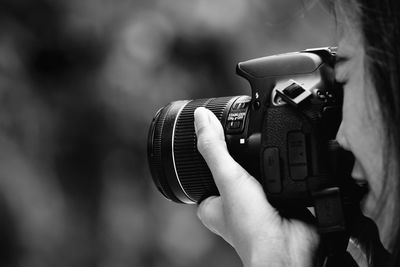 Close-up of hand holding camera