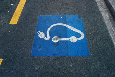 High angle view of arrow sign on road