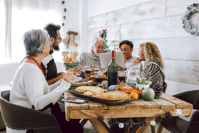 Cheerful people having lunch in restaurant