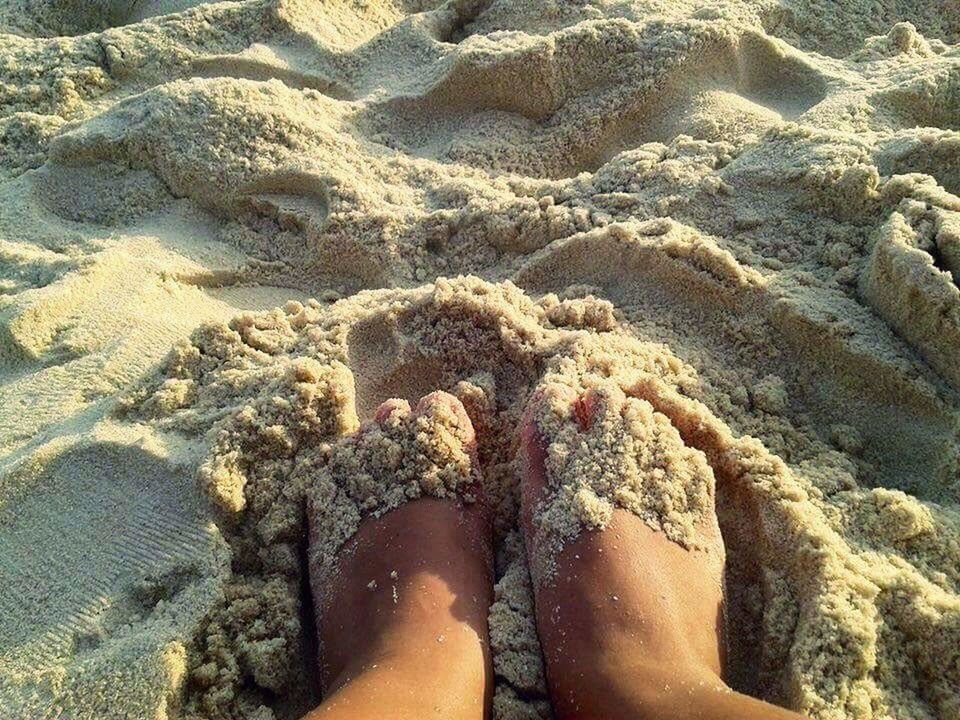 beach, human leg, low section, sand, human foot, day, barefoot, outdoors, high angle view, nature, one person, human body part, sunlight, real people, arid climate, water, beauty in nature, close-up, people