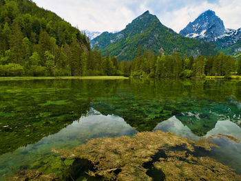 Scenic view of lake and mountains against sky