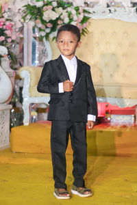 Portrait of boy standing outdoors