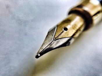 Close-up of pen over water