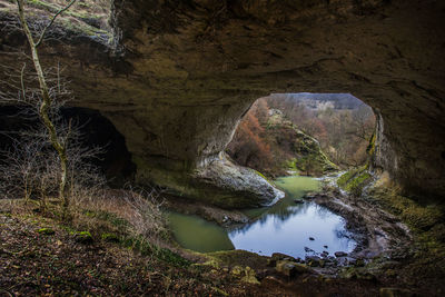 Water flowing through rocks , cave