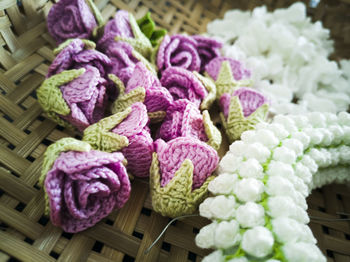 Close-up of multi colored flowers in basket