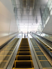 Low angle view of escalator in building