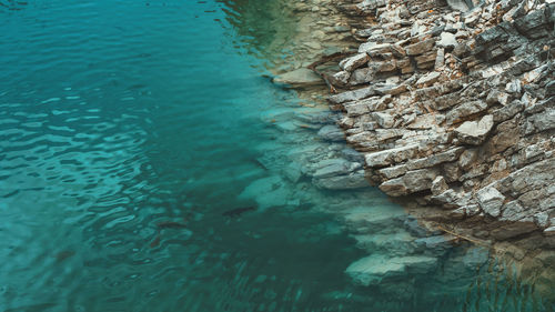 High angle view of rock formation in sea