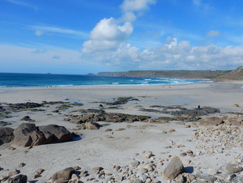 Scenic view of beach against sky
