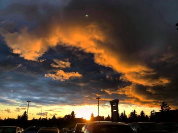 Low angle view of silhouette city against sky during sunset