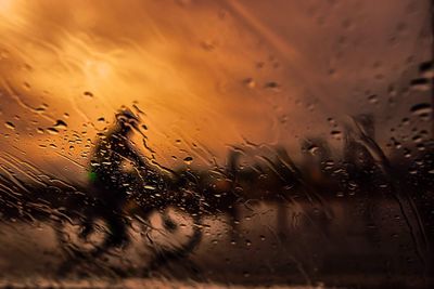 Close-up of wet glass window in rainy season