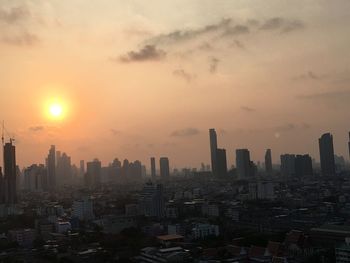 Cityscape against sky during sunset