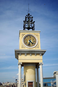 Low angle view of clock tower against sky