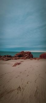 Scenic view of beach against sky