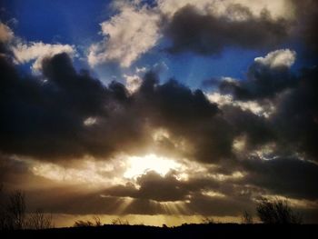 Low angle view of cloudy sky at sunset