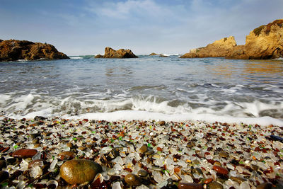 View of calm beach against sky