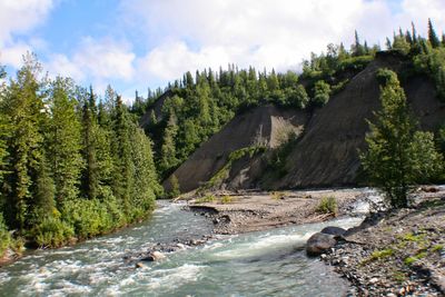 Scenic view of river stream against sky