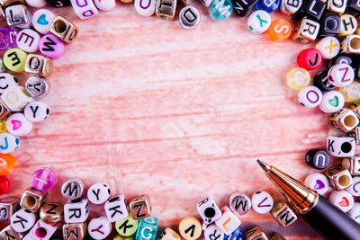 Directly above shot of pen and letters on table